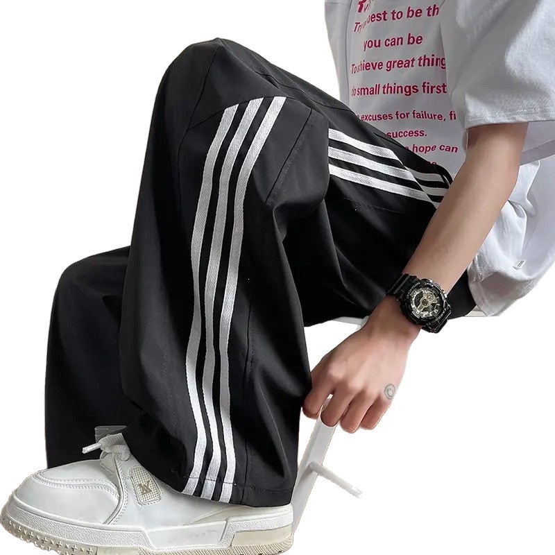 Pantalones casuales a rayas para hombres de primavera y otoño nuevos estudiantes adolescentes sueltos comercio exterior americano tres pantalones para hombres de verano
