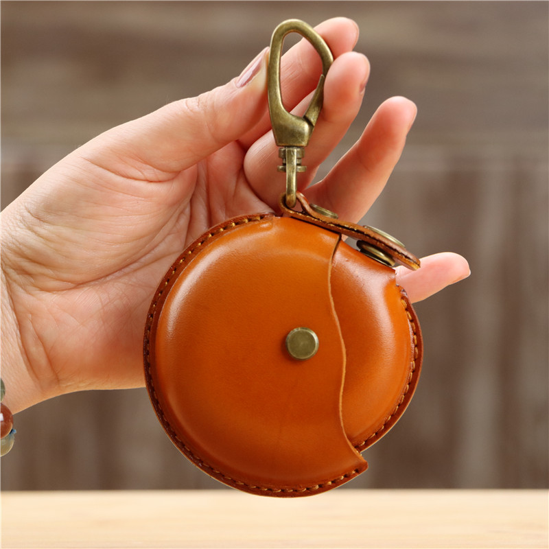 クリエイティブな一層牛革製ハンドメイド小銭入れ、イヤホンケーブル収納バッグ、丸型バッグ、ペンダント、小物入れ、レトロ収納バッグ