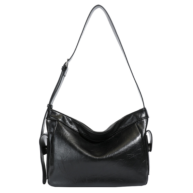 Retro perezoso estilo de viaje bolsas debajo de las axilas para mujeres otoño y invierno 2025 nuevo hombro ancho bolso de hombro nicho textura mochila
