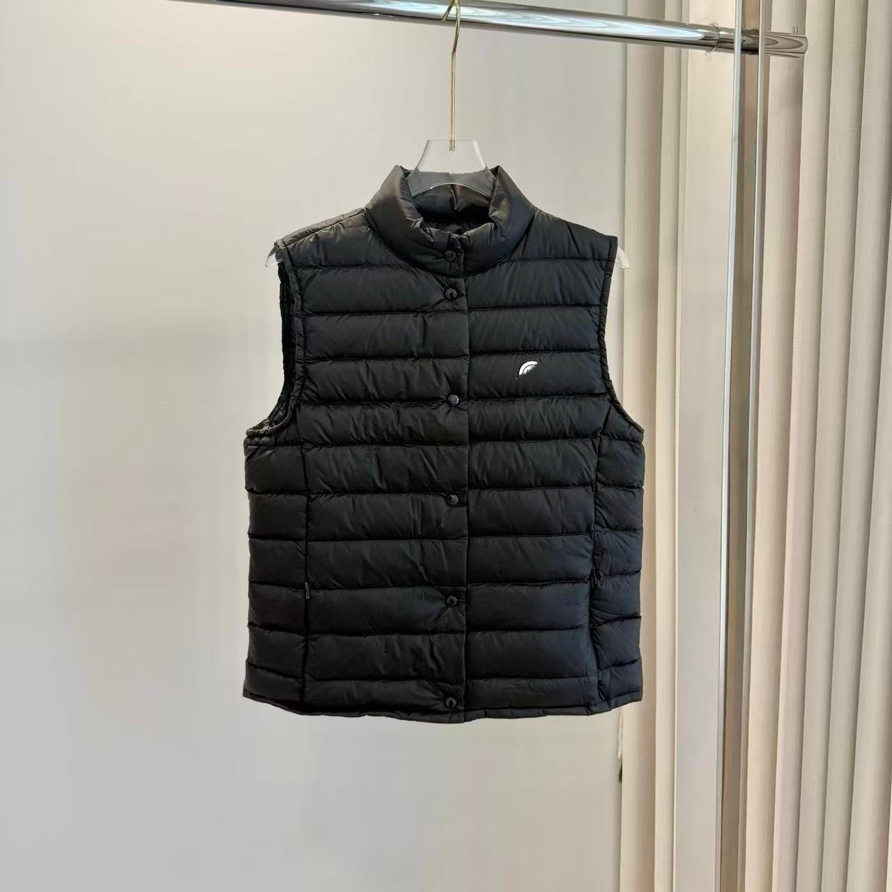 High-quality, lightweight, stand-up collar vest for women, featuring white goose down, a slim fit, and a flattering silhouette. This is the 2026 new style, a warm and stylish down vest