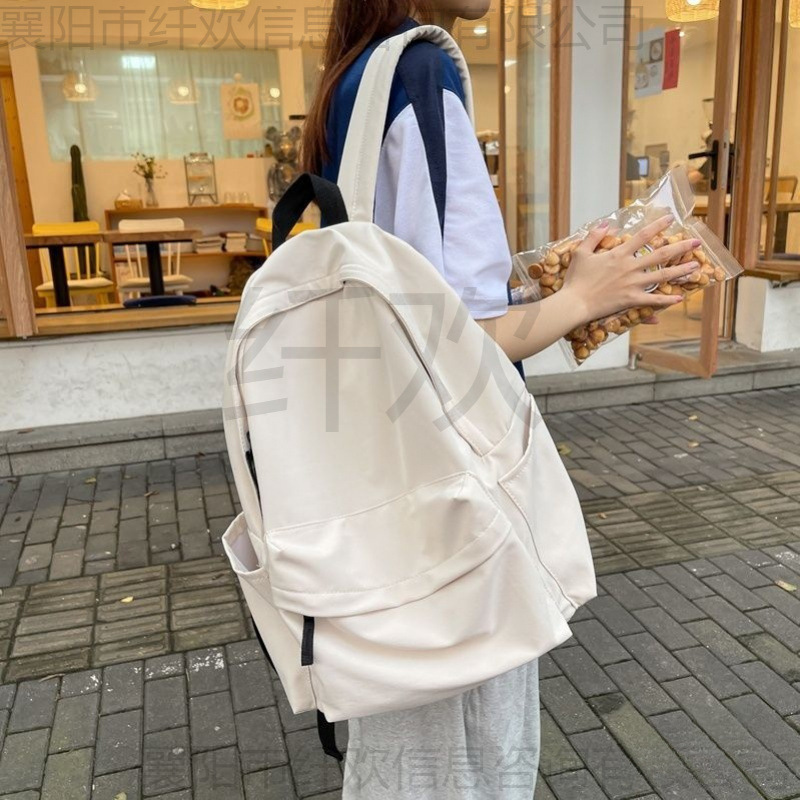 大容量双肩包新款学院风书包女日系女大学生休闲简约帆布宾雀