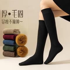 ふくらはぎの靴下の女性の冬の超厚い保温の長い筒の靴下の東北のベルベットの厚い足の保護と膝の高い筒の綿の靴下