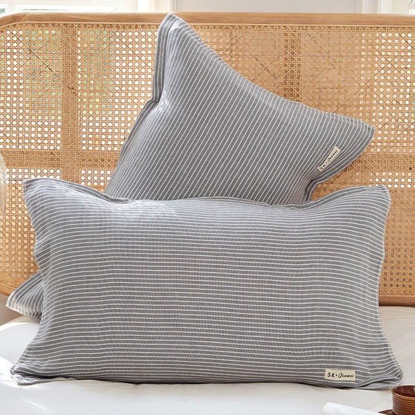A gray striped strap pillow