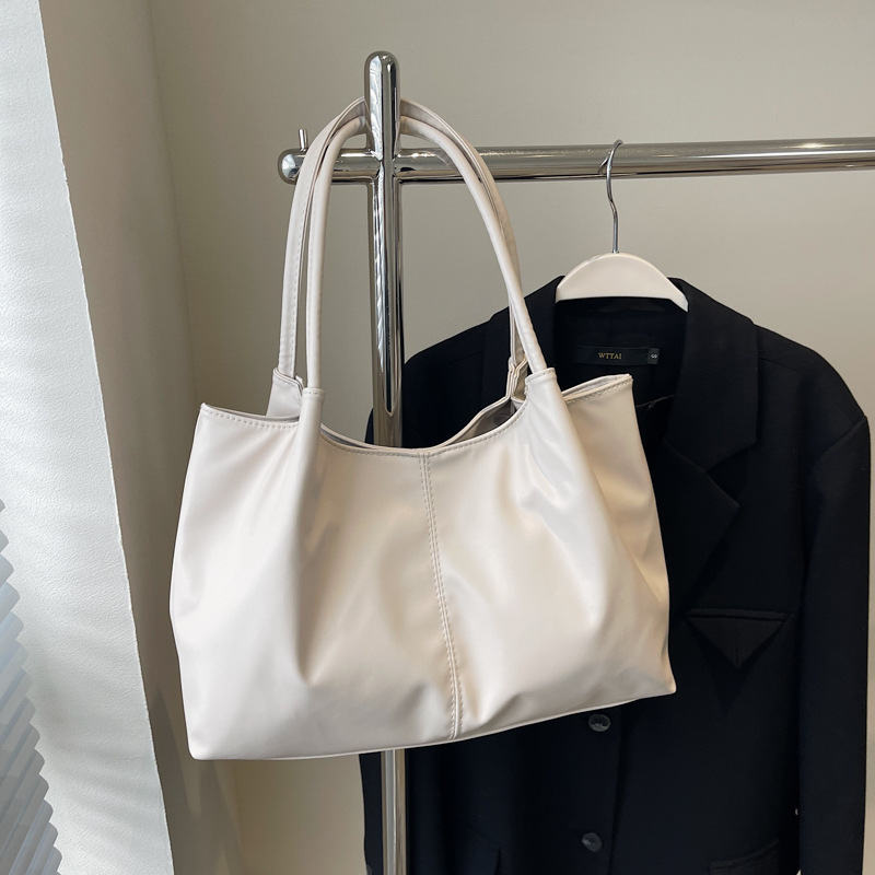 Baja de diseño de nicho popular este año, nicho japonés y coreano de gran capacidad, bolso de hombro para viajes diarios.