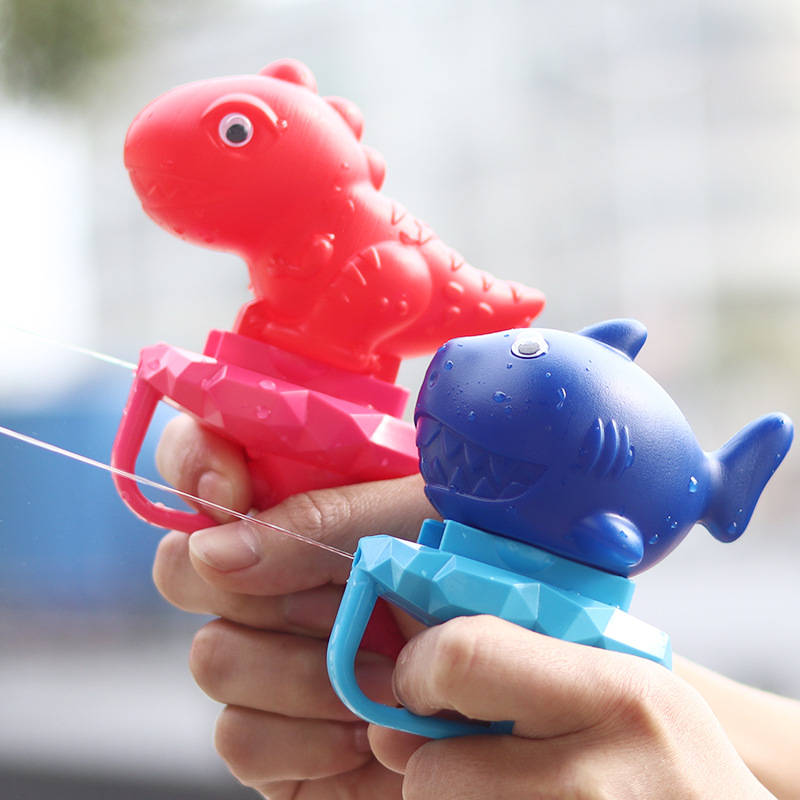Niños de dibujos animados transfronterizos dinosaurio pistola de agua lucha de agua juguetes de agua de verano niños Prensa de dibujos animados pequeña pistola de agua al por mayor