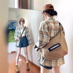 アメリカのレトロな格子のシャツの女性の春と秋の薄いタイプの夏のゆったりしたデザイン感の小さい大衆の長袖の日焼け止めのシャツの上着