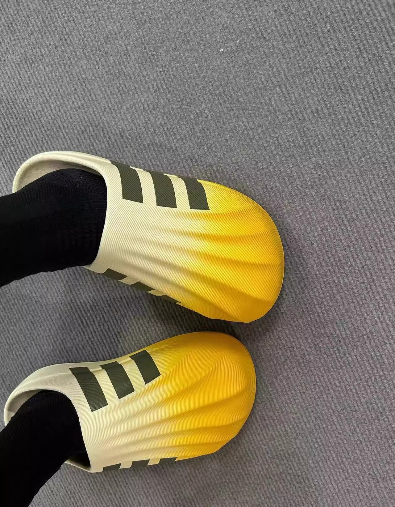 Putian EVA auténtico primavera y otoño nuevo tipo de zapatillas de cabeza de conchas de dopamina para hombres y mujeres zapatillas de agujero de fondo grueso