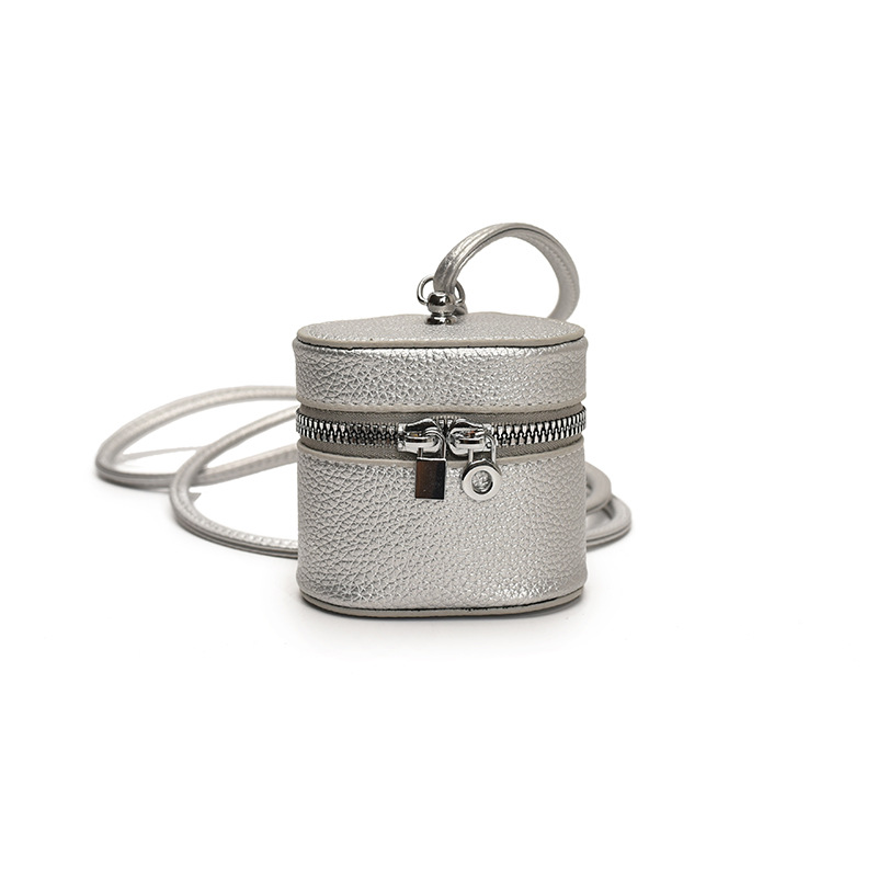 Bolso de hombro para niña coreana simple color sólido mini lindo bolso de cubo para bebé 2025 nuevo bolso de auriculares para niños marea