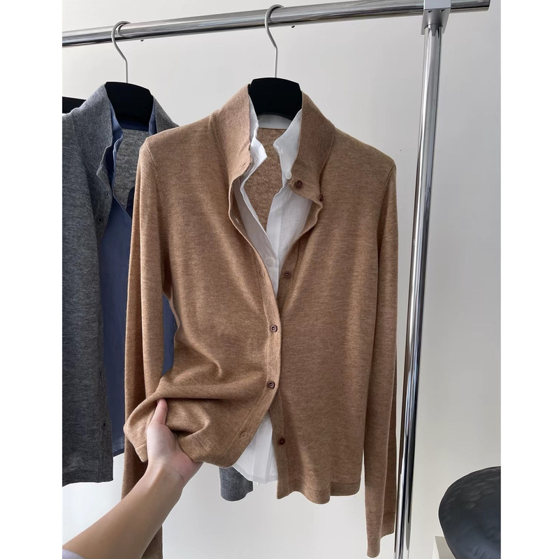 Elegant and understated style: a two-piece look with a linen cardigan and a high-neck, French-inspired wool coat in a classic, old-money style Elegant and understated style: a two-piece look with a linen cardigan and a high-neck, French-inspired wool coat in a classic, old-money style