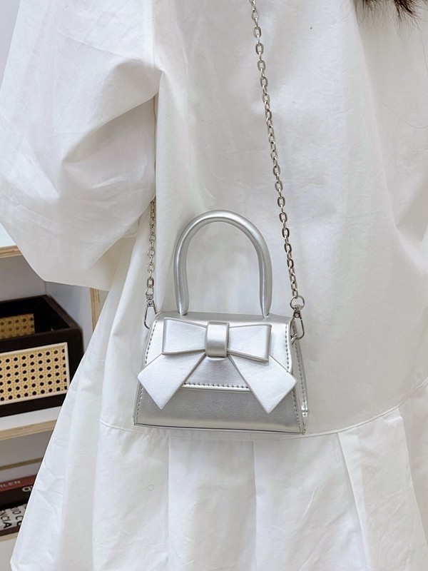 Bolso de mujer 2025 tendencia de primavera nuevo arco de moda para niños bolso de hombro de estilo extranjero bolso de mano