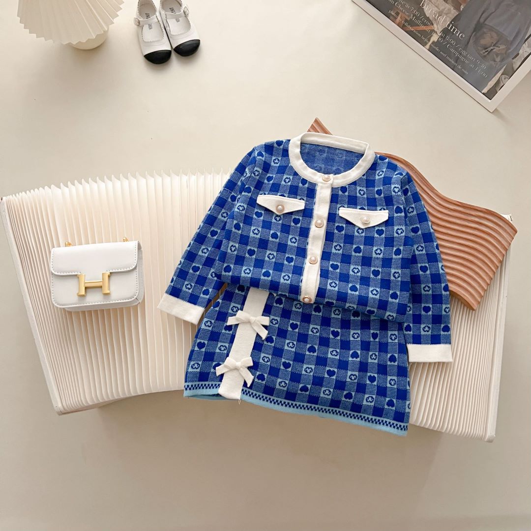JINYONG Koreansk utgåva Love Knitwear Flickkjol med rosett och omlott, liten och medelstor, barnmodell, tvådelat set_voghion.com