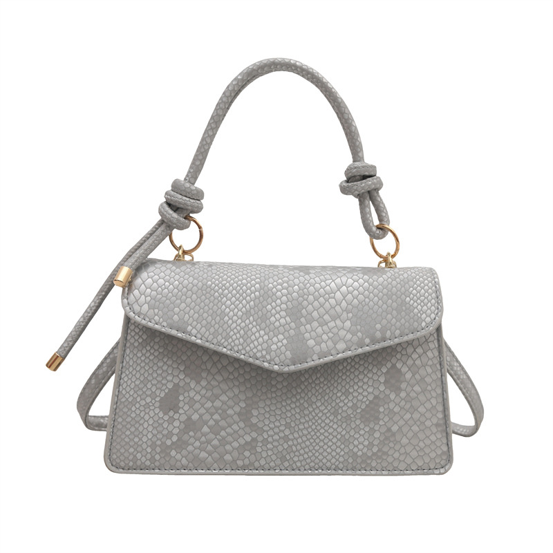 Bolso con estampado de piel de serpiente de diseño de nicho de lujo ligero transfronterizo para mujer 2025 nuevo bolso de mensajero de un solo hombro