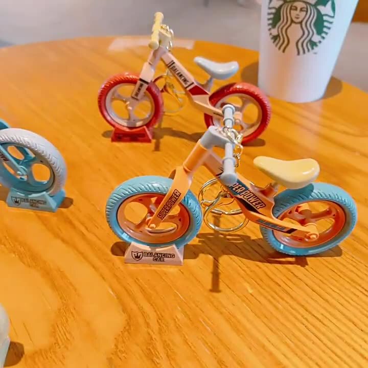 Cartoon Creative Fun Movable and Sliding Bicycle Toys Accessories Keychain Pendants Small Gift Ornaments