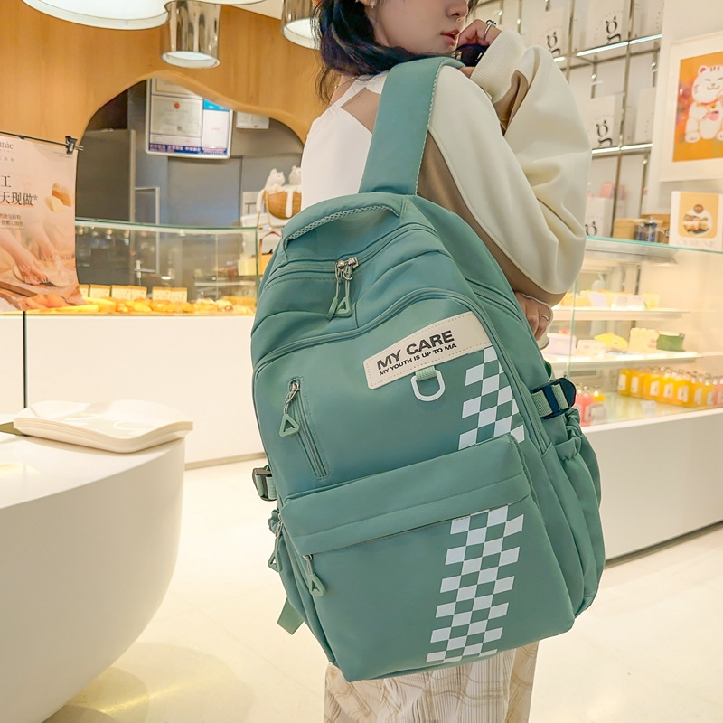 Mochila escolar transfronteriza masculina mochila de estudiante de secundaria para reducir la carga de gran capacidad mochila de computadora de 15,6 pulgadas hembra