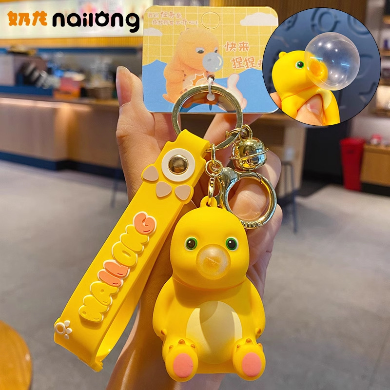 Online Celebrity schoolbag adornos genuino descompresión burbuja leche dragón llavero femenino exquisito creativo pellizcar música colgante clave