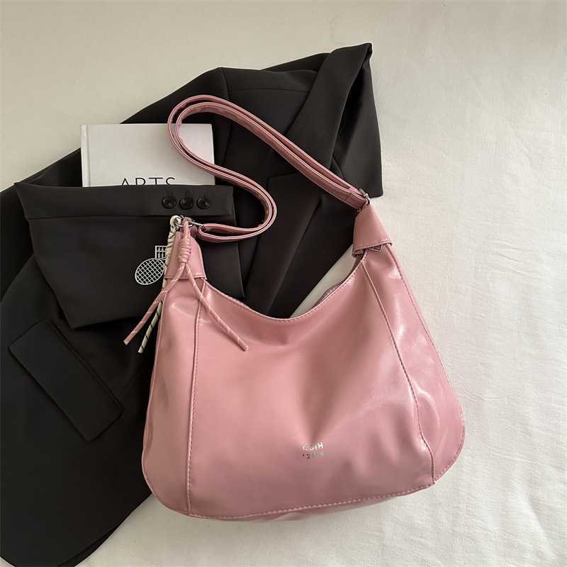 Bolsa de viaje casual de gran capacidad para mujeres 2025 primavera y verano nueva moda versátil hombro de hombro con una sensación relajada bolso