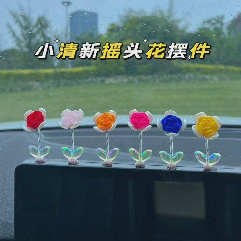 Cute rose car center console ornaments shaking head four-leaf clover electric car interior decoration rearview mirror ornaments
