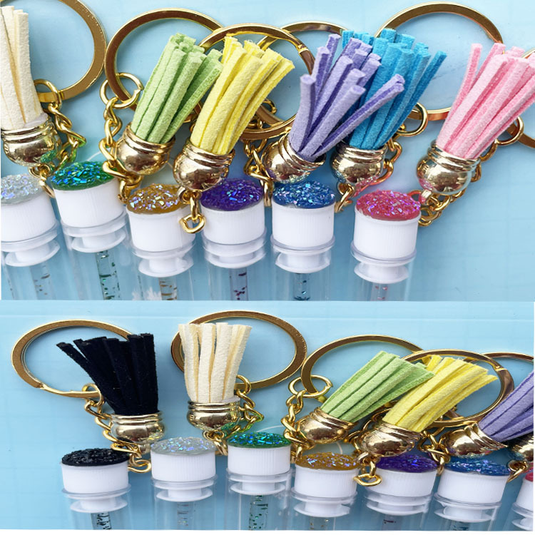 2022 nuevo producto con borlas y llavero tubo cepillo de pestañas tubo independiente cepillo de pestañas postizas rizador de diamantes multicolor