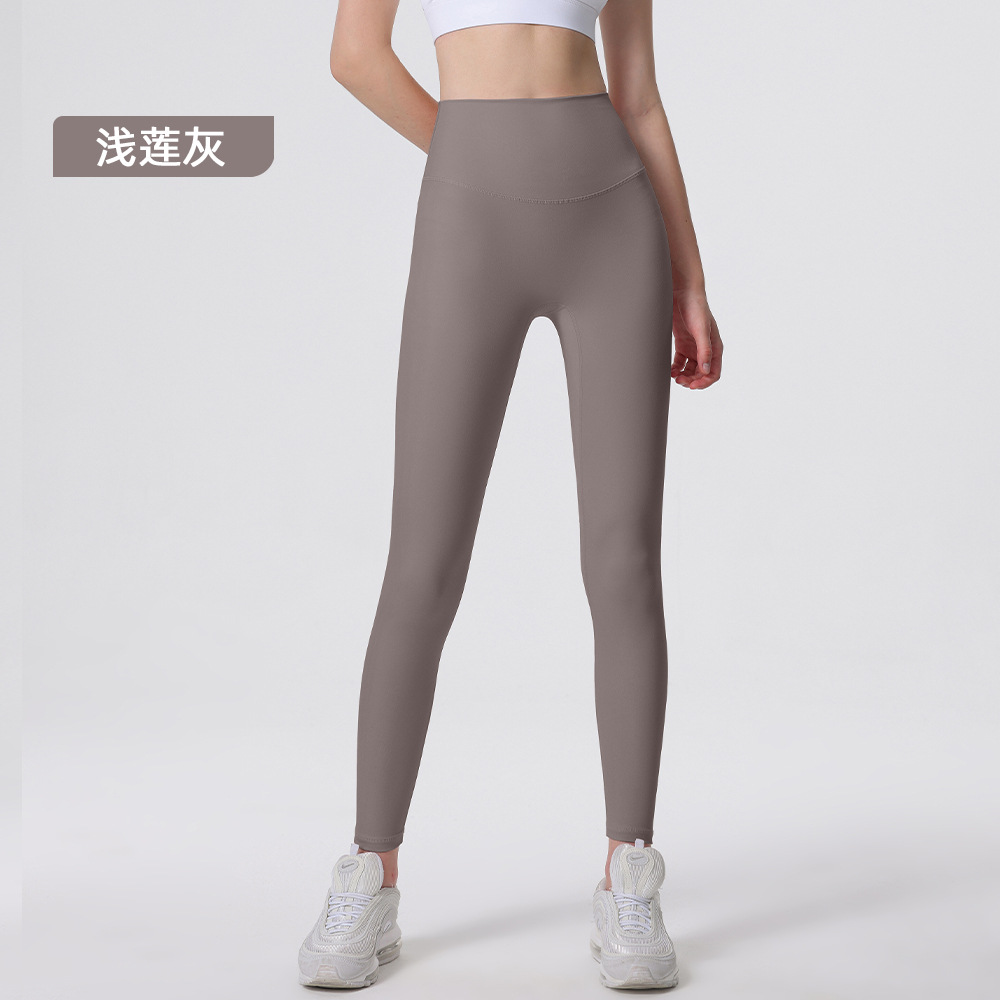 Nuevos deportes de yoga cintura alta desnuda sensación de no vergüenza línea piel-friendly levantamiento de la cadera del vientre que no se contrae la caída de la aptitud de las mujeres pantalones recortados