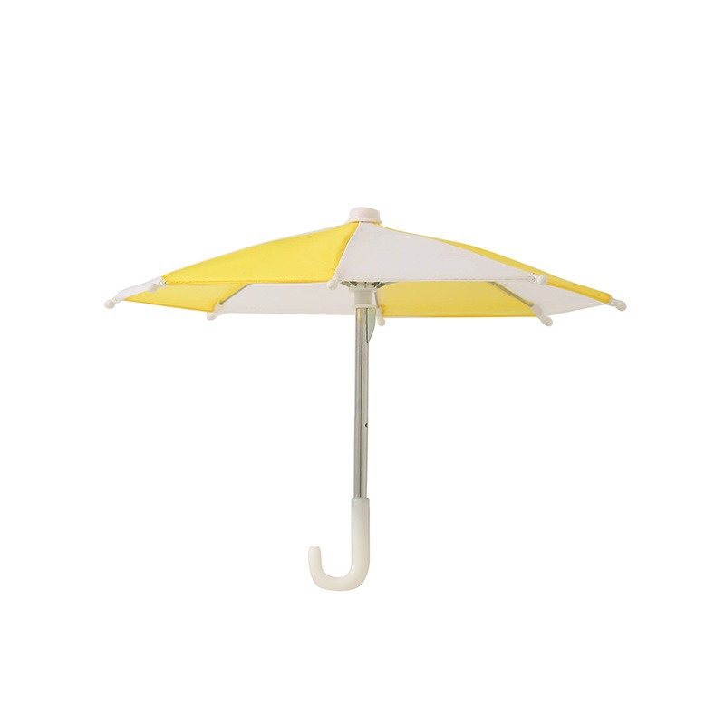 Yellow and white toy umbrella