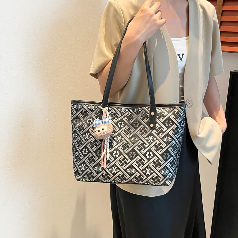 2025 nuevo estilo nacional de diseño de patrón oscuro bolso de mujer gran capacidad versátil bolso de viaje bolso de hombro de moda ligero de lujo