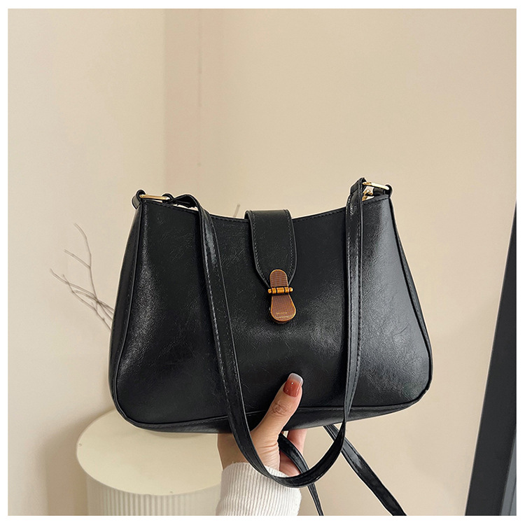 Nichezhong retro simple bolso de brazo bolso de mujer 2025 primavera nueva moda bolso pequeño de viaje de moda mochila de hombro