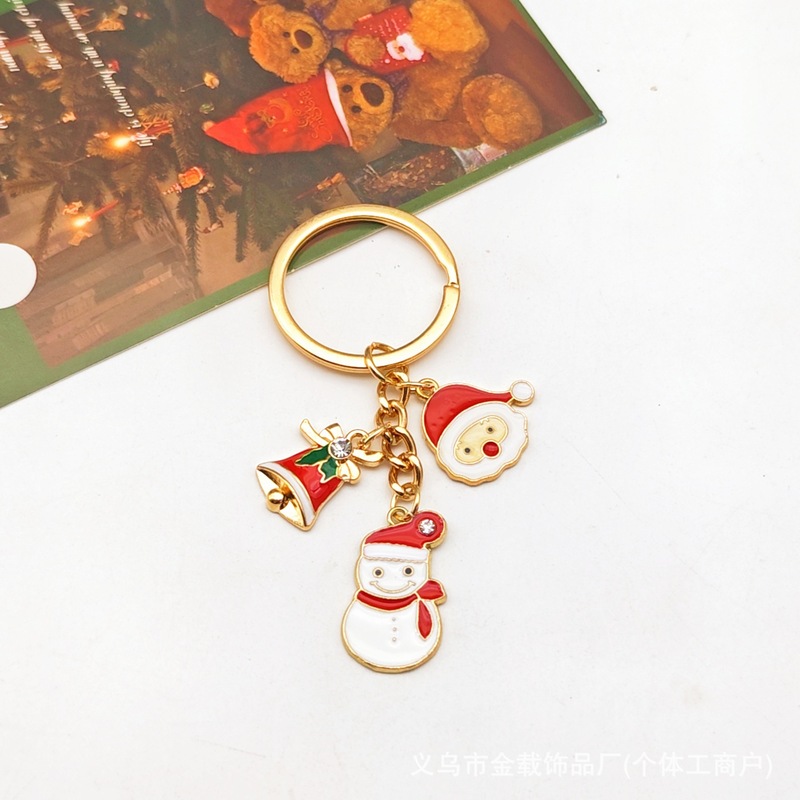 クリスマスのキーチェーンのクリスマスツリーは精巧なサンタクロースのヘラジカのプレゼントの箱の鈴のアクセサリーの包みのペンダントを飾ります。|undefined