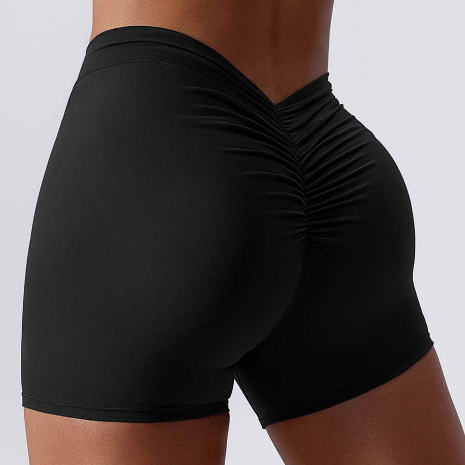 Color sólido cintura espalda V arrugas cadera elevación desnuda pantalones de tres puntos pantalones de yoga elásticos transpirables pantalones cortos de fitness de secado rápido para mujeres