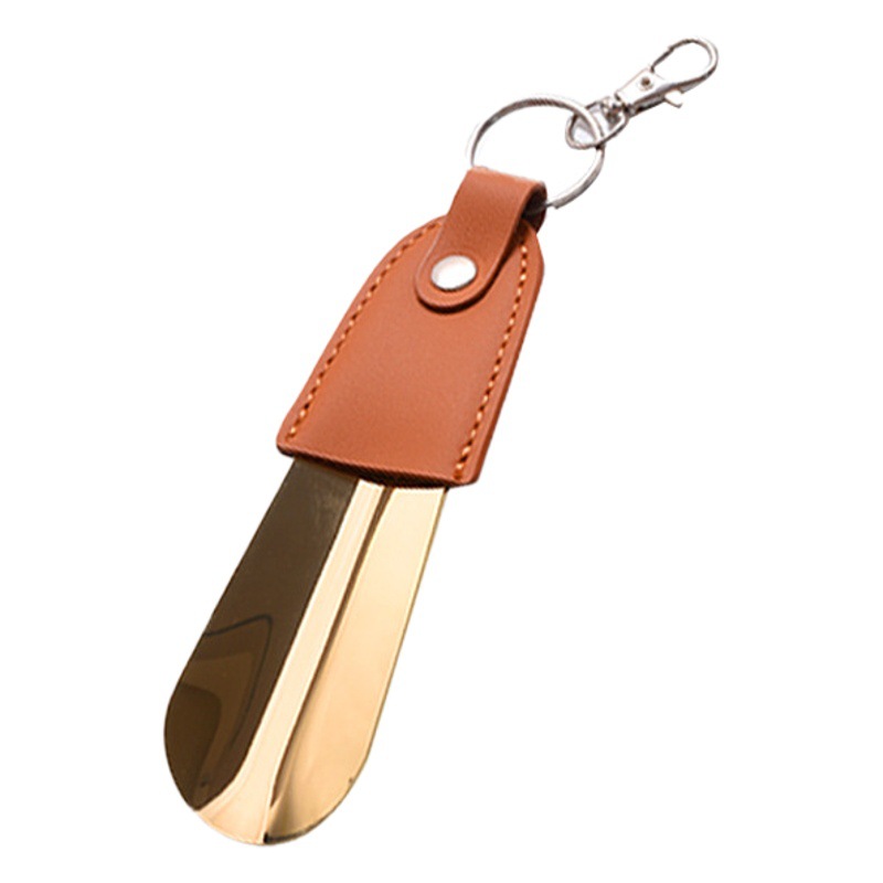 En stock suministro de acero inoxidable hebilla de llave tirador de zapatos con cubierta de cuero tirador de zapatos llave del coche colgante fácil de llevar levantador de zapatos