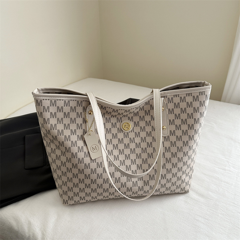 Europa y América retró personalidad de gran capacidad letras impresas simples bolsos grandes para mujeres 2025 nueva bolsa de hombro de viaje