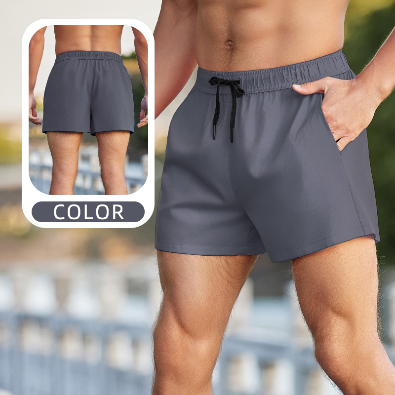 Pantalones cortos deportivos para correr anti-exposición de los hombres falsos de dos piezas de entrenamiento suelto al aire libre pantalones de fitness delgados pantalones cortos de secado rápido