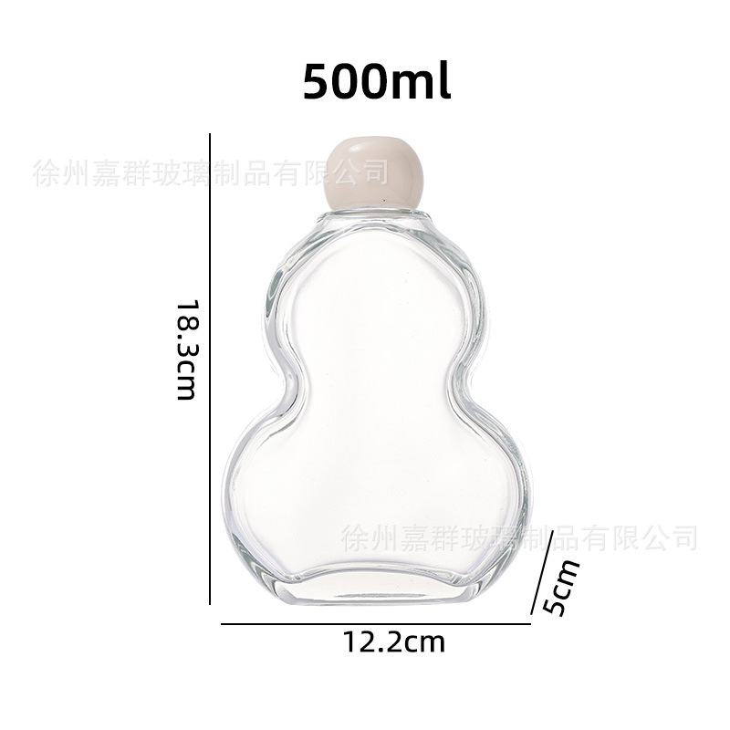 Botellas de vidrio transparentes de vino de fruta, bebida de jugo de fruta, té de leche, vino de fruta auto-elaborado, engrosado envasado, botellas vacías en stock al por mayor