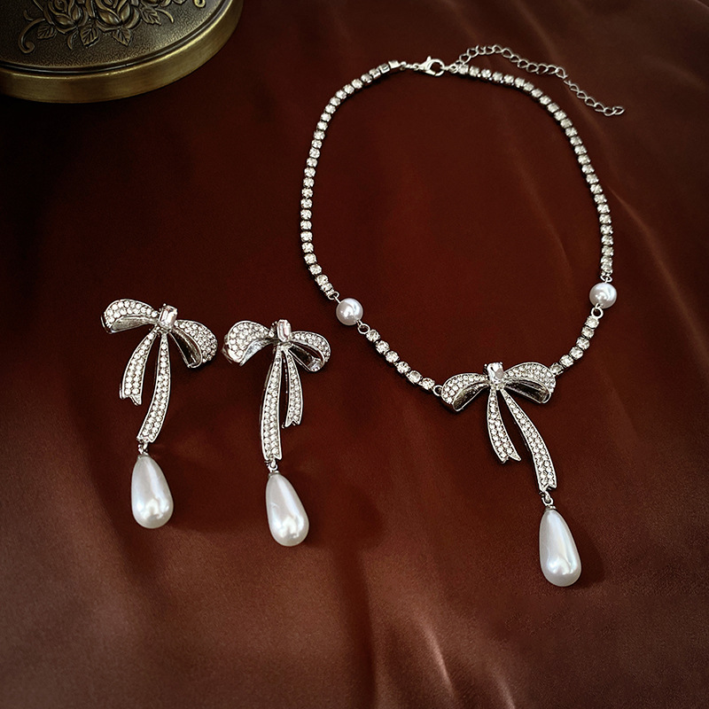 Silver Needle Diamond Bow Pearl Drop Earrings