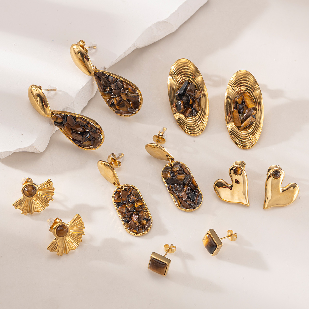 Taina europa y americana pendientes de acero inoxidable lujo ligero de alto nivel sensación de piedra triturada natural pendientes al por mayor joyería transfronteriza nicho