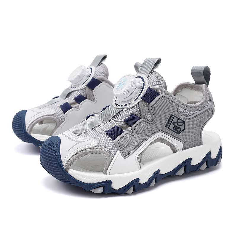 Sandalias Baotou para niñas 2025 nuevo botón giratorio para niños grandes zapatos de playa para niños antideslizantes de suela suave y resistentes al desgaste