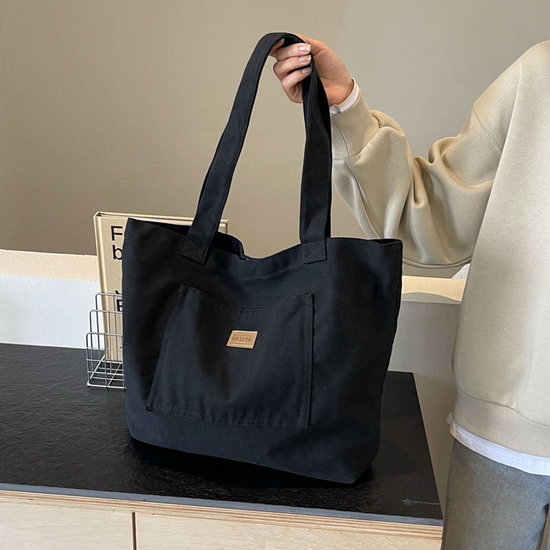 Bolso de lona para mujer 2024 nuevo bolso de hombro de gran capacidad de color sólido casual simple y versátil bolso de clase al por mayor