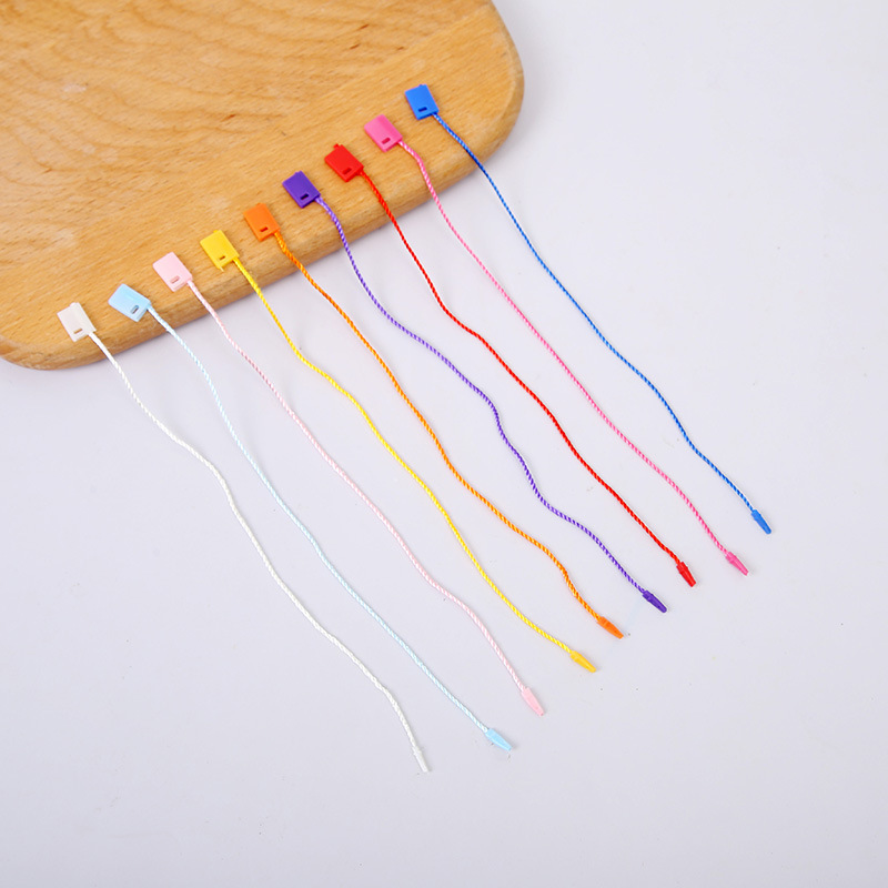 厂家供应黑色白色彩色小方头服装吊粒圆扣粗绳带银丝吊粒吊绳现货