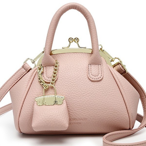 Venta al por mayor primavera y verano nuevo estilo bolso femenino retro bolso de clip bolso de mano moda todo fósforo bolso pequeño de mensajero de un solo hombro femenino