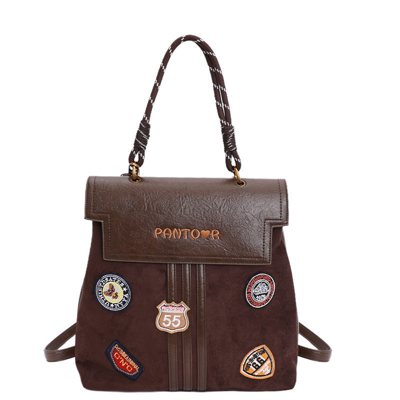 Comercio exterior insignia transfronteriza clase universidad mochila de viaje de la escuela de moda mejora la sensación de calidad retro mochila de gran capacidad