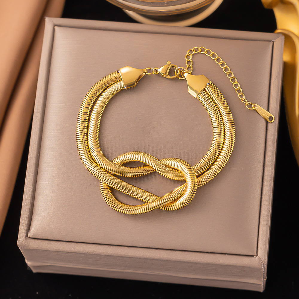 38【e77】knotted snake bone chain bracelet gold