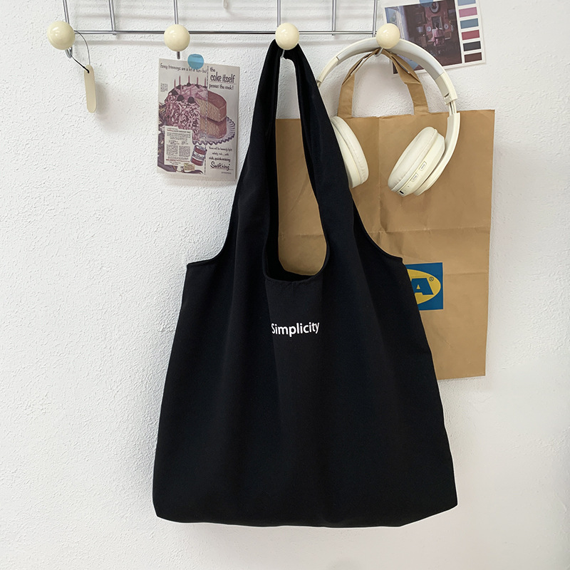 秋冬キャンバスバッグ黒色アルファベットベストバッグ大容量旅行休暇バッグ学生授業バッグバッグショッピングバッグ