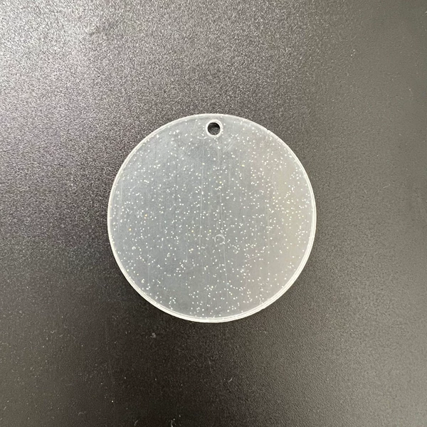 Transparent glittering round