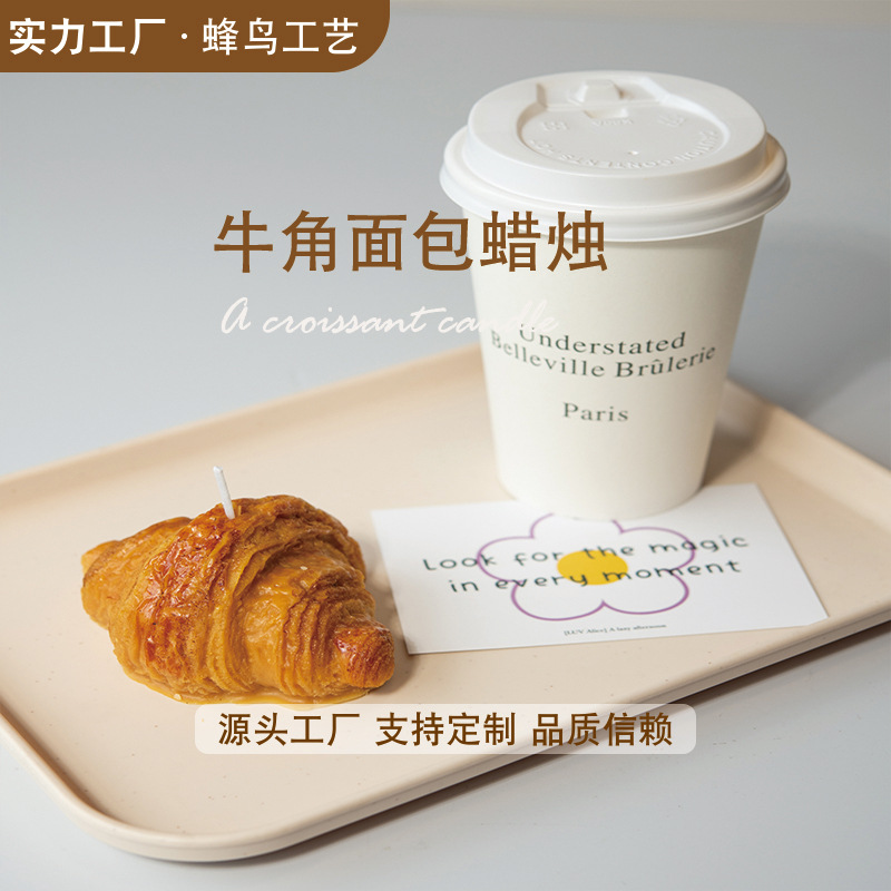 Ventas transfronterizas en caliente croissants con forma de panela de banano, decoración de simulación avanzada, postres, regalos de mano al por mayor.