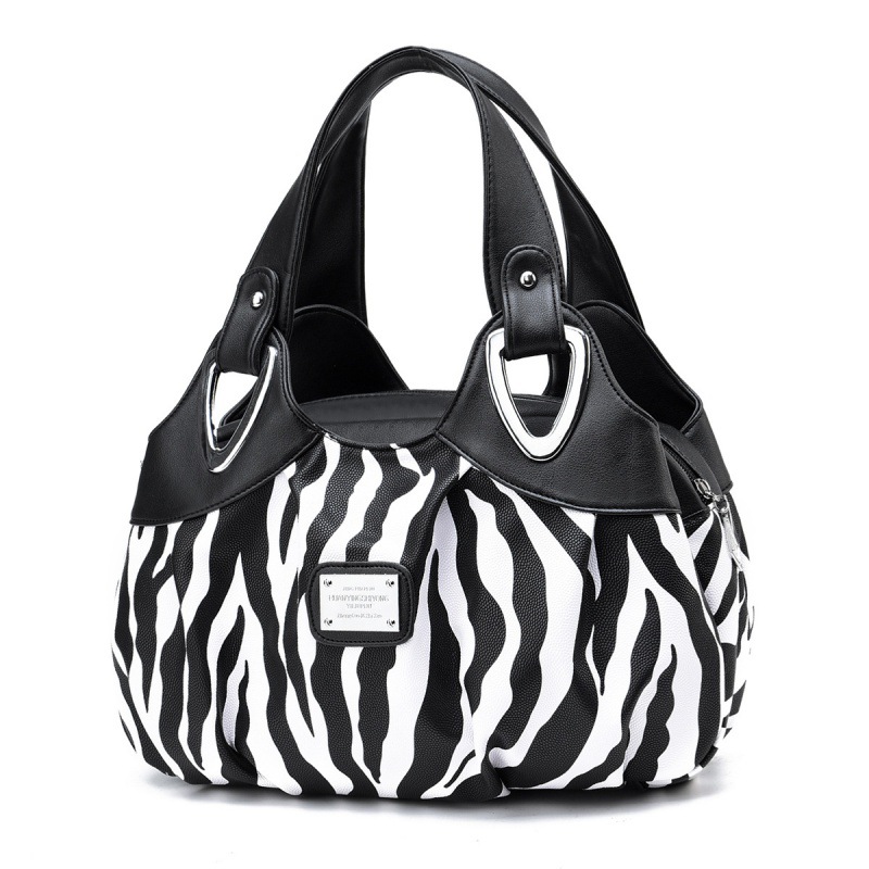 Fábrica al por mayor de color de contraste nueva moda europea y americana de gran capacidad de moda estilo occidental impreso simple bolso de mujer de una sola pieza de entrega