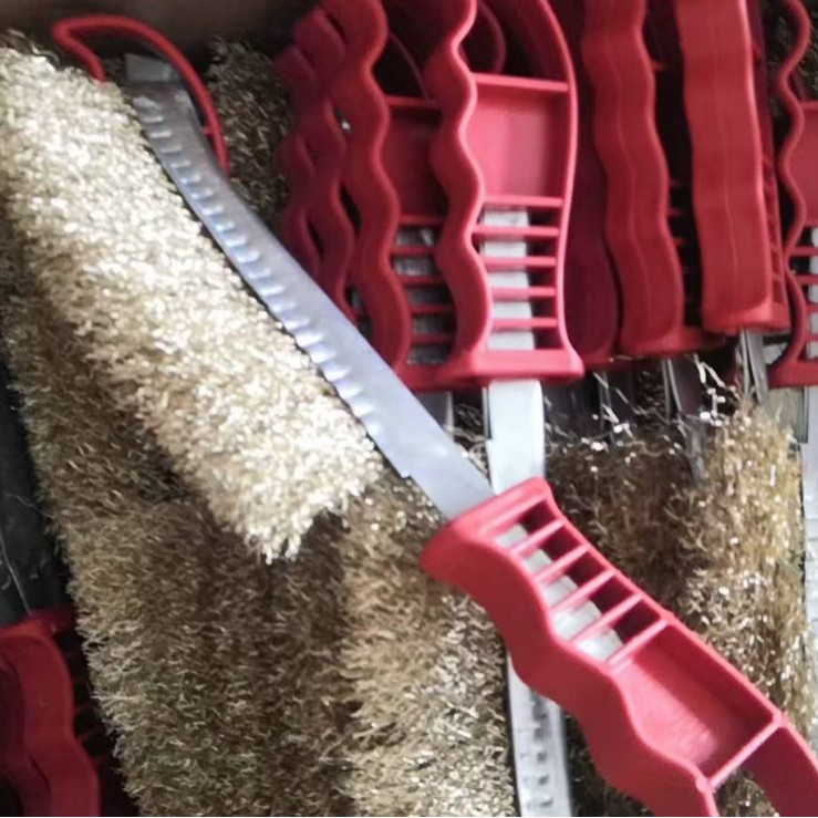 Cepillo de eliminación de óxido Cepillo de pulido Cepillo de descalcificación Cepillo de alambre de acero con mango rojo de plástico Cepillo de alambre de barbacoa Cepillo de acero inoxidable