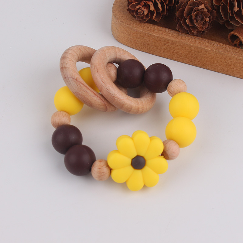 Nuevo juguete de mano para bebé con sonajero, los molares de los niños pueden morder el castaño de haya, margarita, pulsera de flores, mordedor