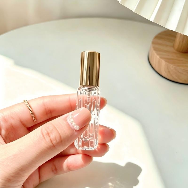 En stock al por mayor 10ml botella de spray de perfume de vidrio rosa de oro boquilla de aluminio perfume sub-botella prensa botella vacía
