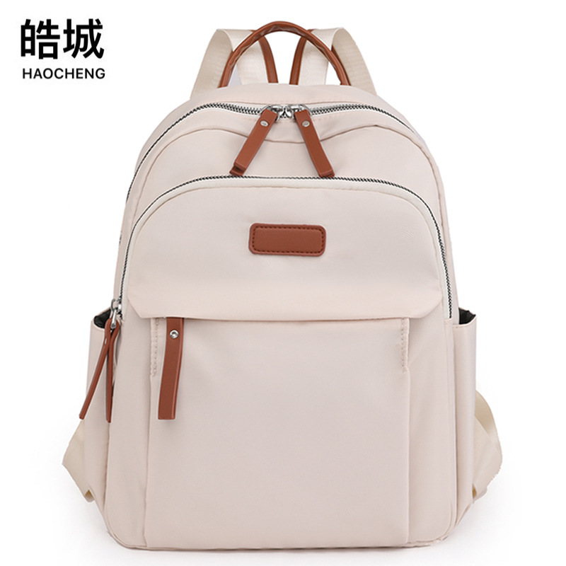 Bolsos para mujer 2023 nueva mochila casual para mujer de nailon moda todo fósforo color de contraste mochila ligera mochila escolar al por mayor