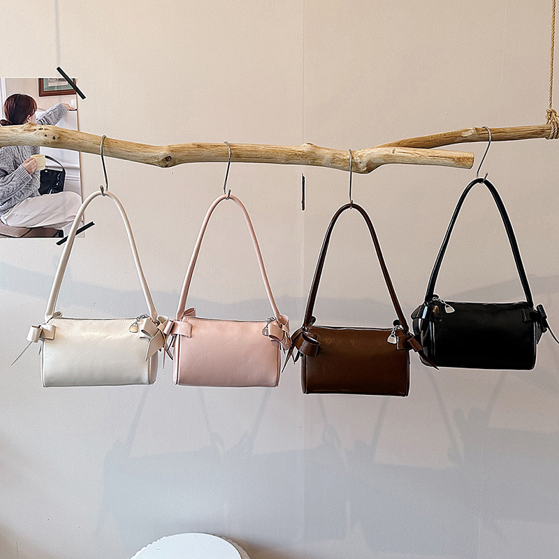 Bolsos de brazo de arco de arco de aire extranjero diarios para mujeres verano 2026 nuevo tipo de lujo ligero versátil bolso de hombro de viaje image 5
