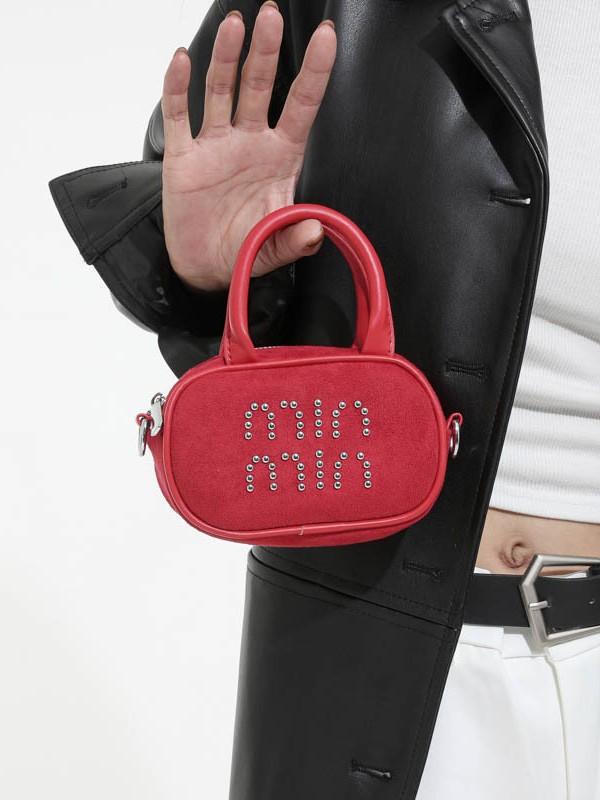 Alta sensación retro de seda mini bolso de mano para mujeres 2025 nuevo alta sensación de humedad de moda mochila